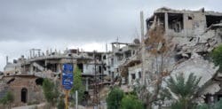 Zniszczona dzielnica w Homs